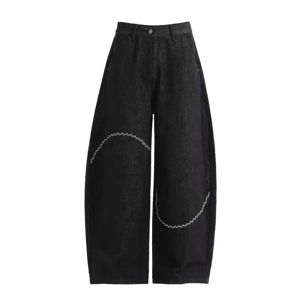 Black straight-leg denim trousers with mid waist and zip fly on mannequin