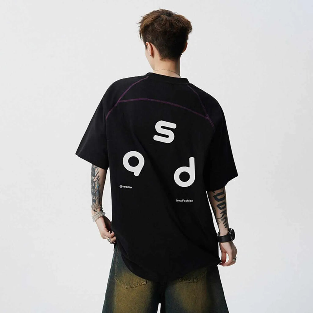 Loose-fit black cotton short-sleeve t-shirt with white letter print graphic on a mannequin.
