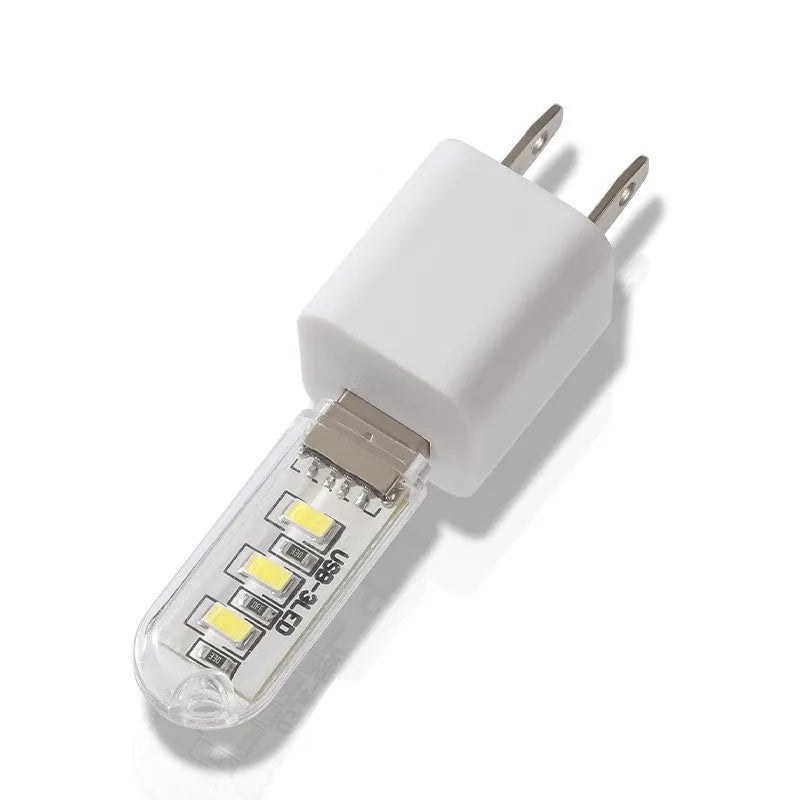 Small round USB-powered LED baby night light showing white or warm light options