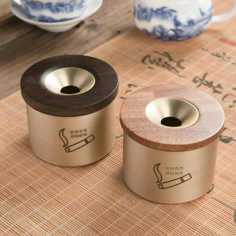 Retro solid copper ashtray with a wooden lid showing the centre hole.