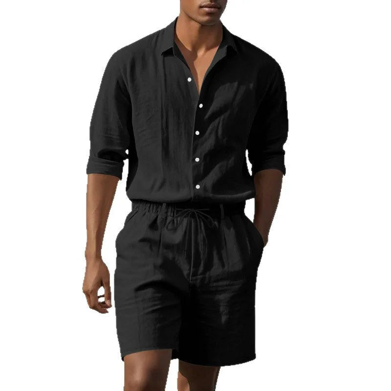 A man wearing a light blue linen long sleeve shirt and matching shorts from the beach suit set.