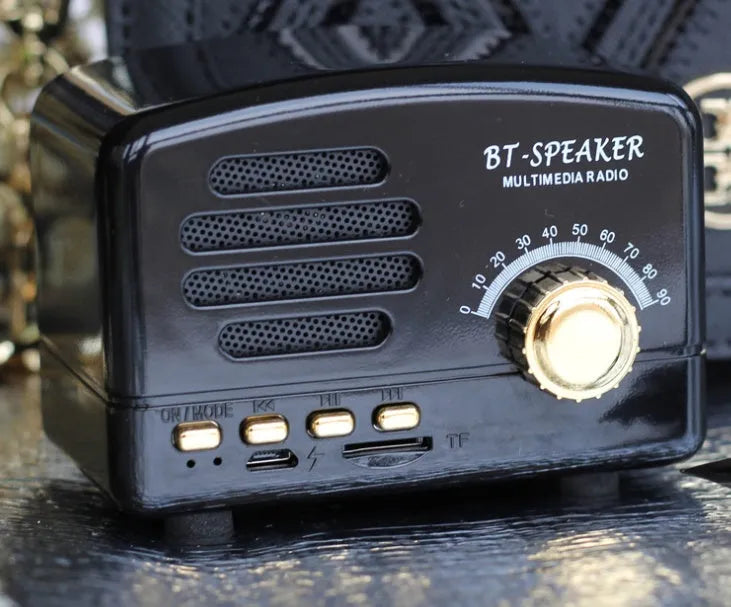 Vintage wood finish Bluetooth speaker in black, pink and wood grain colours showing compact 93x70x59mm dimensions