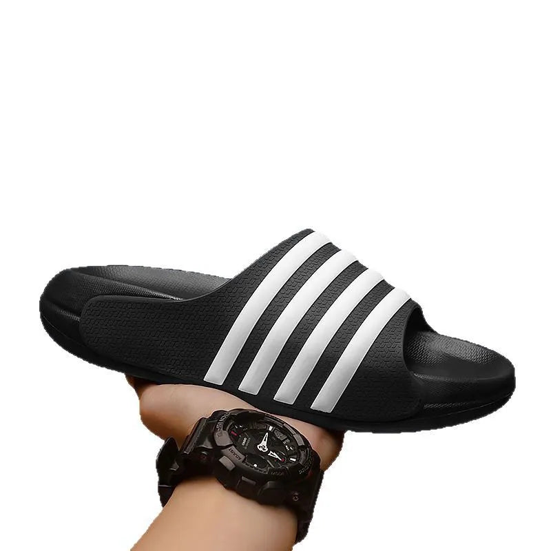 A pair of casual unisex slippers with a PVC upper and EVA sole, shown in one of four available colour options.