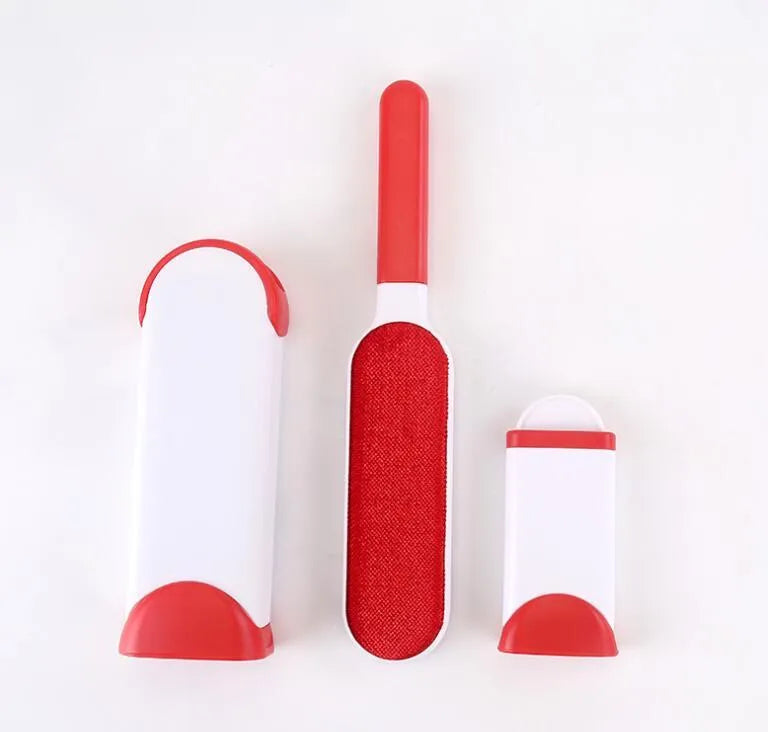 Blue reusable pet hair remover brush with self-cleaning base for removing fur from a grey sofa.
