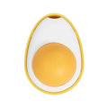 Interactive plush catnip ball toy stuck on a wall, showing Fried Egg and Poached Egg shape options.