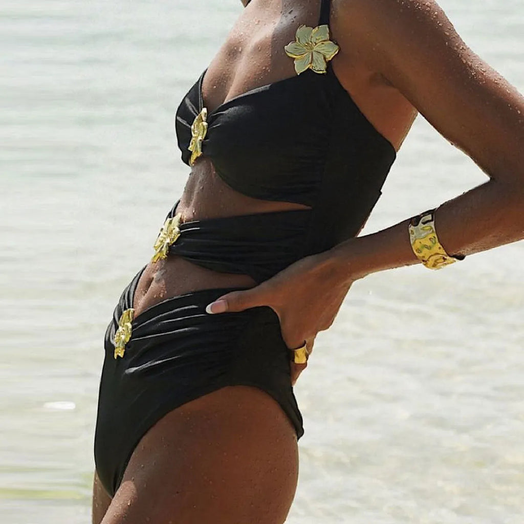 Women's solid colour one-piece swimsuit with a matching removable short skirt in a high-waisted design.
