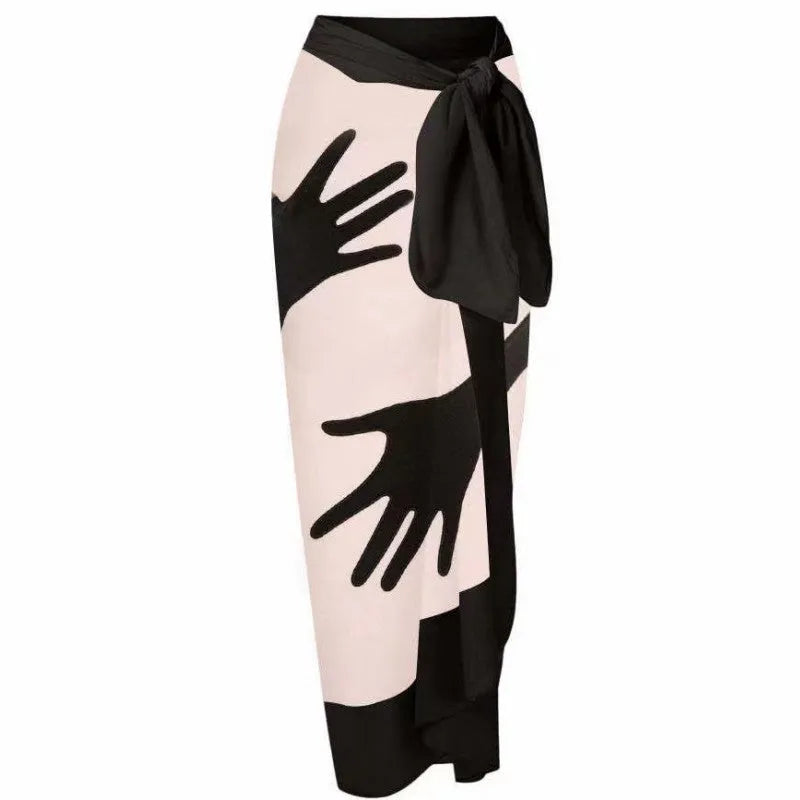 Women's patterned polyester bikini swimsuit with a long attached tulle skirt overlay.
