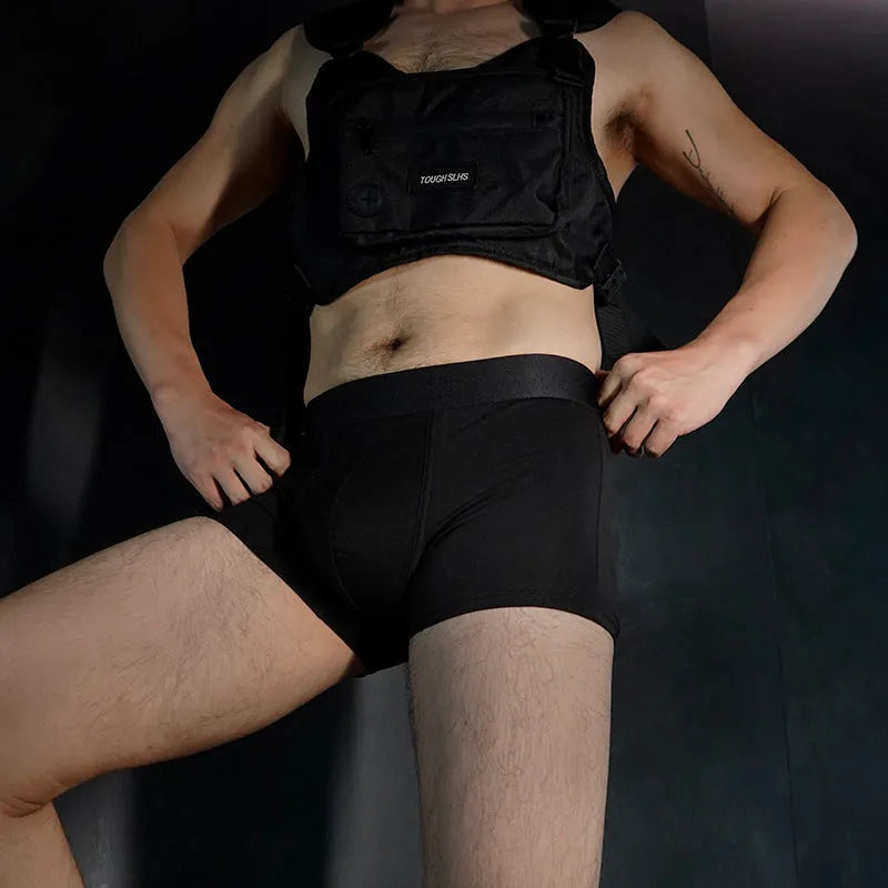 Men's solid colour cotton boxer shorts in black, displayed flat
