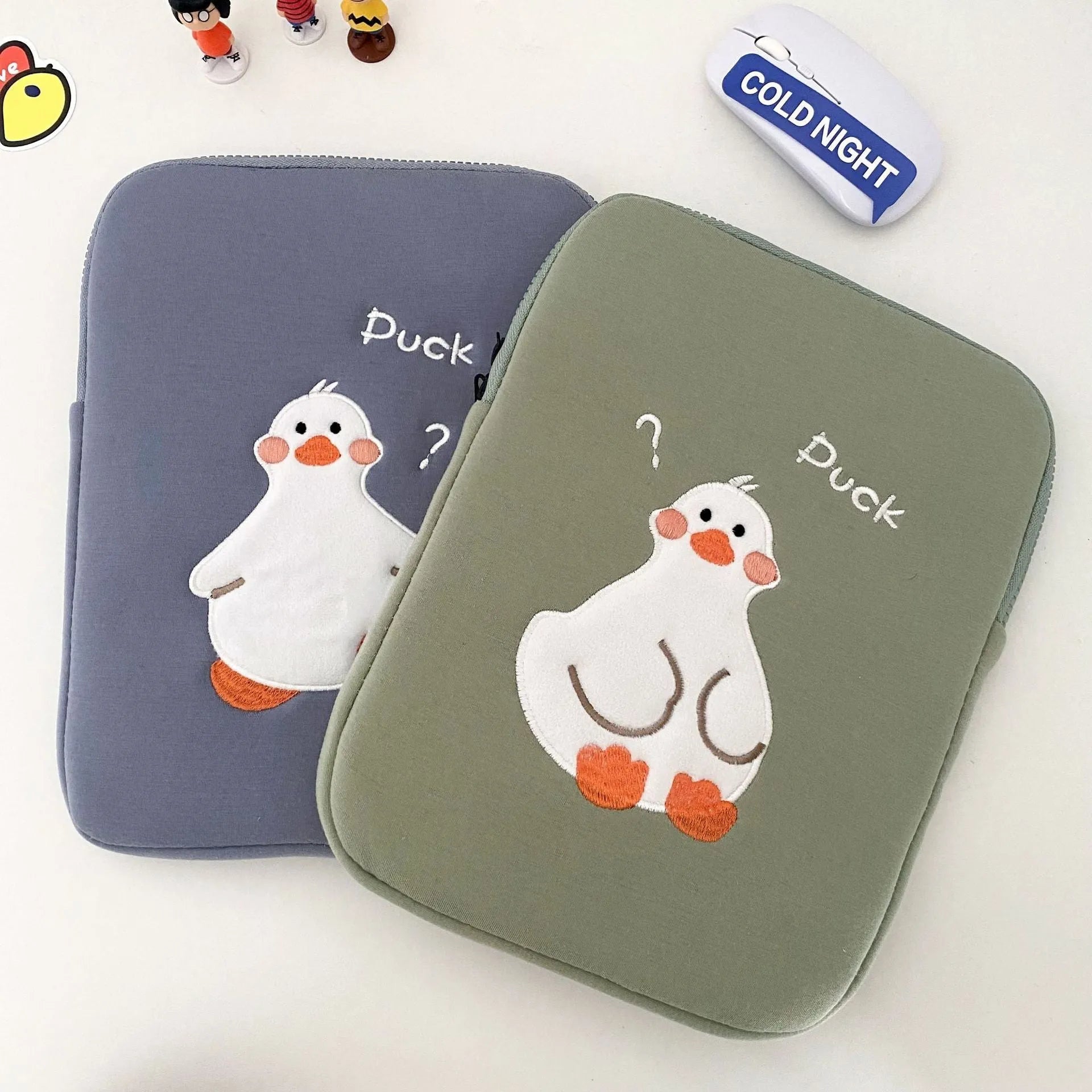 Blue cotton tablet case with cartoon duck embroidery and a zip closure, sized for an 11-inch tablet.