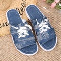 Blue Roman style women's canvas slippers with rubber sole and cloth lining displayed flat
