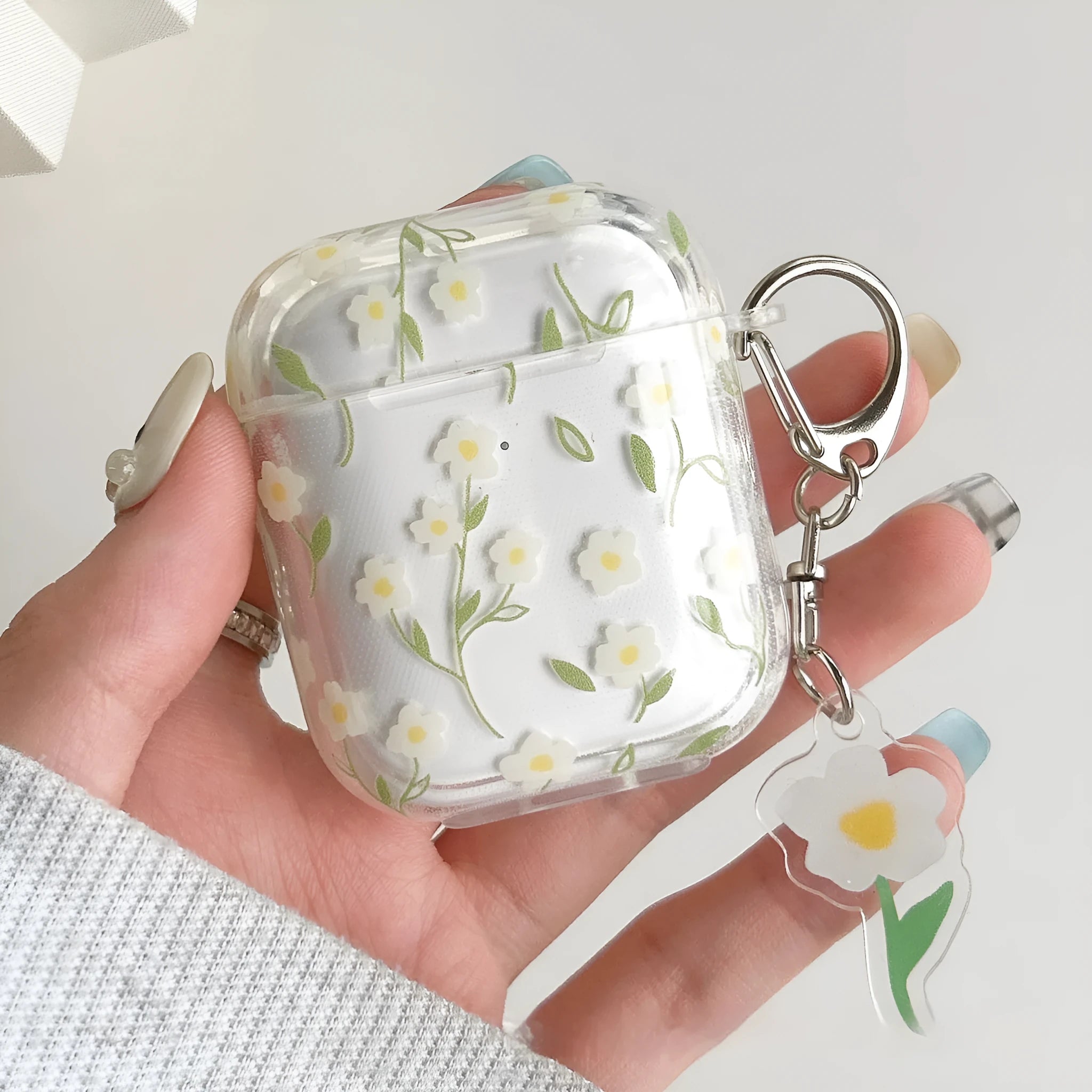 White floral pattern TPU protective cover for Apple AirPods charging case showing high transparency