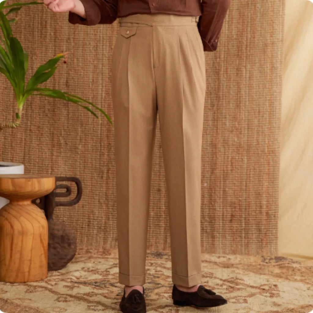 Men's slim fit straight leg trousers in wrinkle-resistant polyester fabric on a hanger.