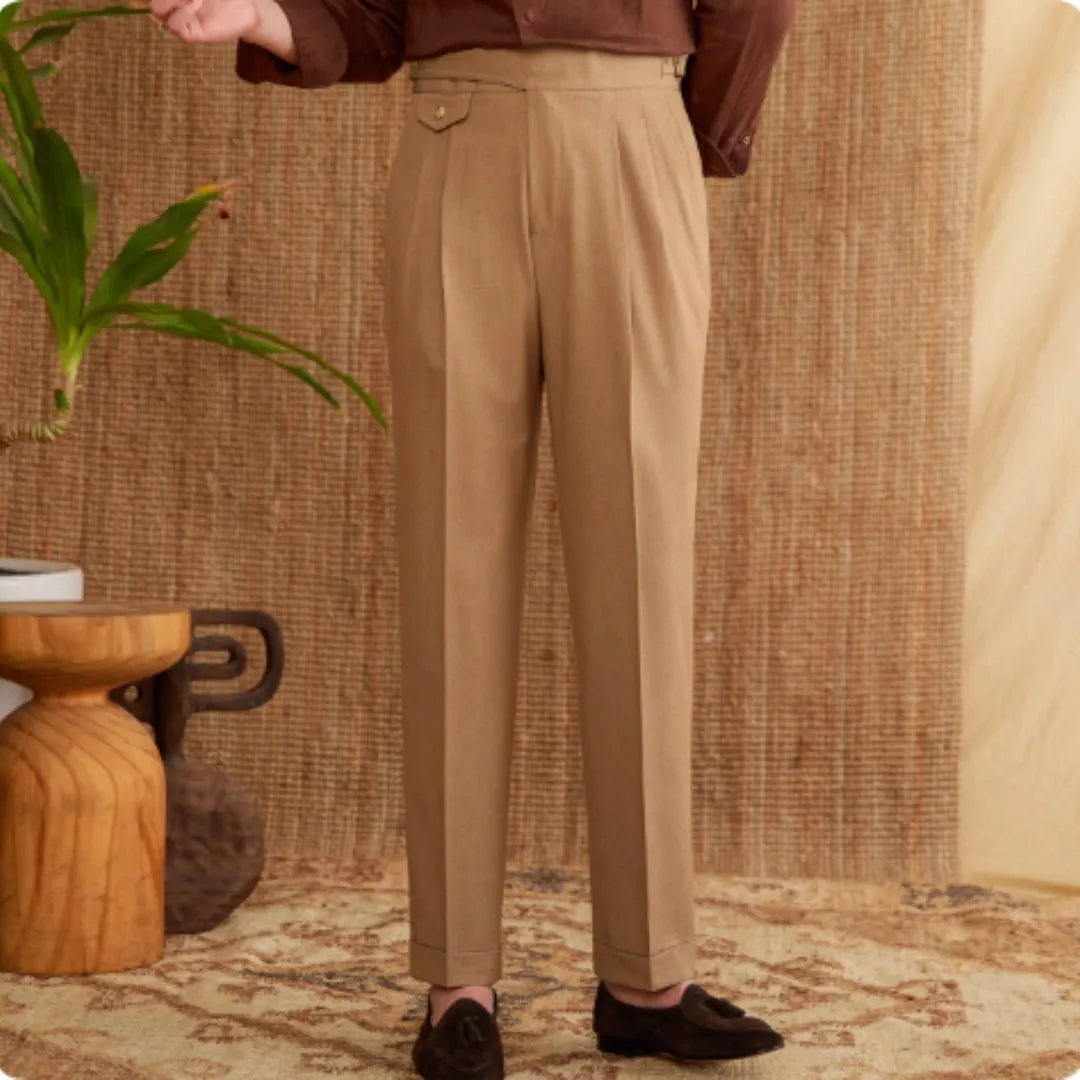 Men's slim fit straight leg trousers in wrinkle-resistant polyester fabric on a hanger.