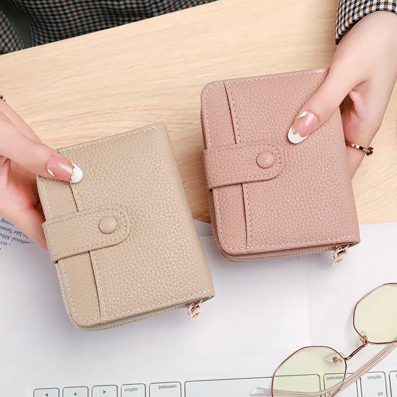 Ladies short wallet with lychee pattern in beige pink black or red colours showing 2-fold design