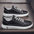 Men's white casual shoes with PU upper, flat sole, and round toe on a plain background.