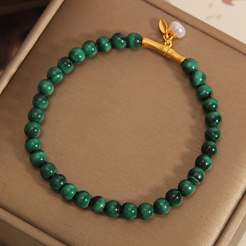 Women's adjustable bamboo bracelet with white crystal elements on a wrist.