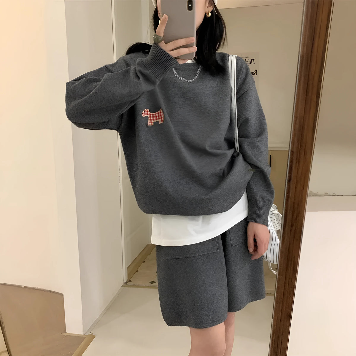 Women's milk blue knitted sweater and shorts loungewear set with embroidered animal pattern.