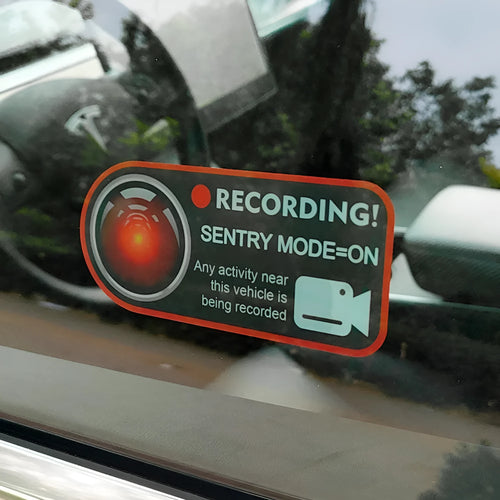 Pair of black and white electrostatic warning stickers for Tesla sentry mode, sized 11cm by 5cm.