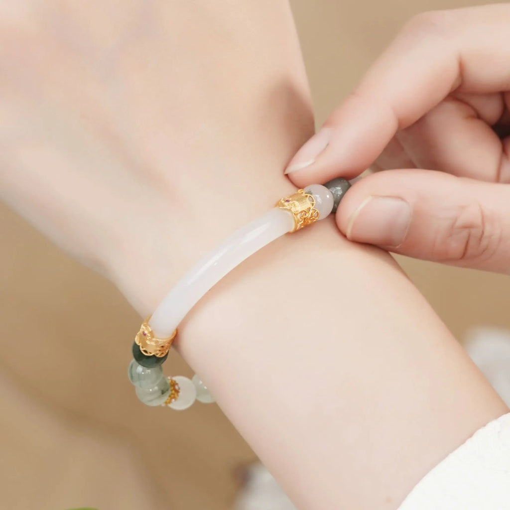 Light green Tian Shan Cui jade women's half bracelet with floating flower girl design in Chinese folk style.