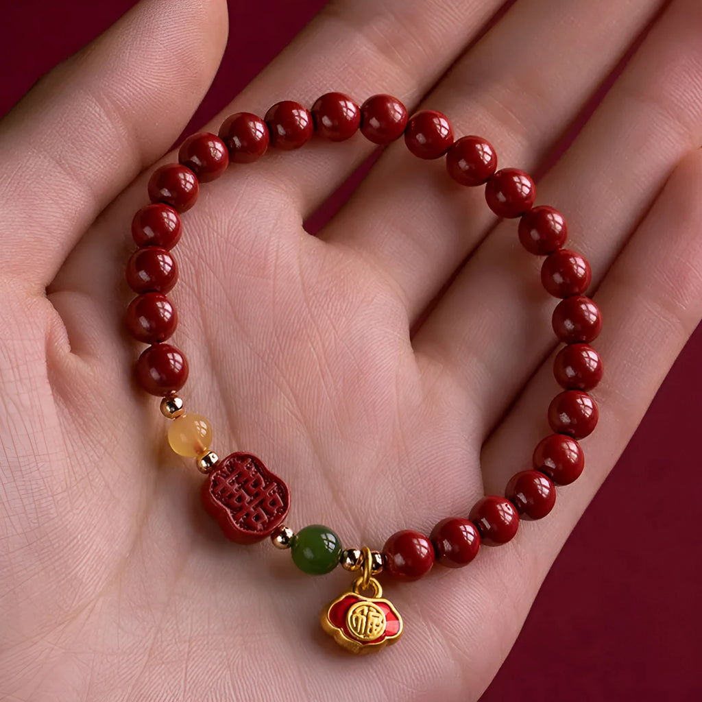 Happy Eyebrow Bracelet with fu character bead on raw emperor sandstone cinnabar beads.