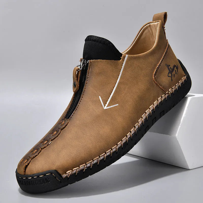 Men's black zip-up casual leather boots with round toe and hand-stitched rubber sole.