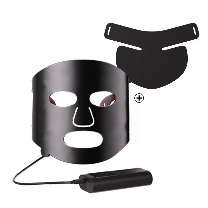 Black and white LED phototherapy face mask with controller for home skin treatment.