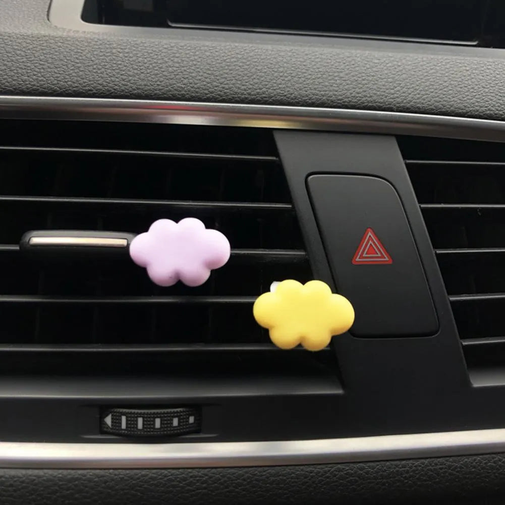Resin car fragrance clip with Baiyun cartoon cloud design mounted on car air vent