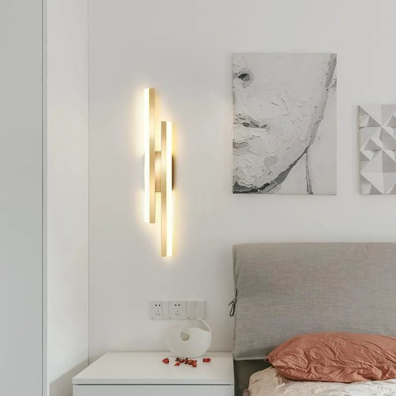 Scandinavian minimalist LED wall light with an acrylic shade on a black arm, mounted on a light-coloured wall.