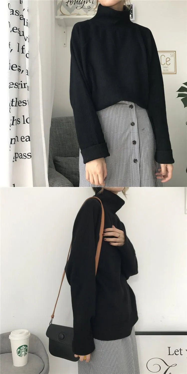 Women's loose fit half-high collar long sleeve top in solid colour on a hanger.