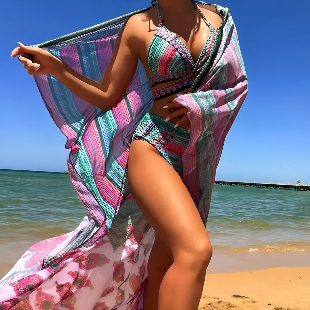 Blue women's bikini set with cross bandage top, high-waist briefs with side ties, and a matching smock.