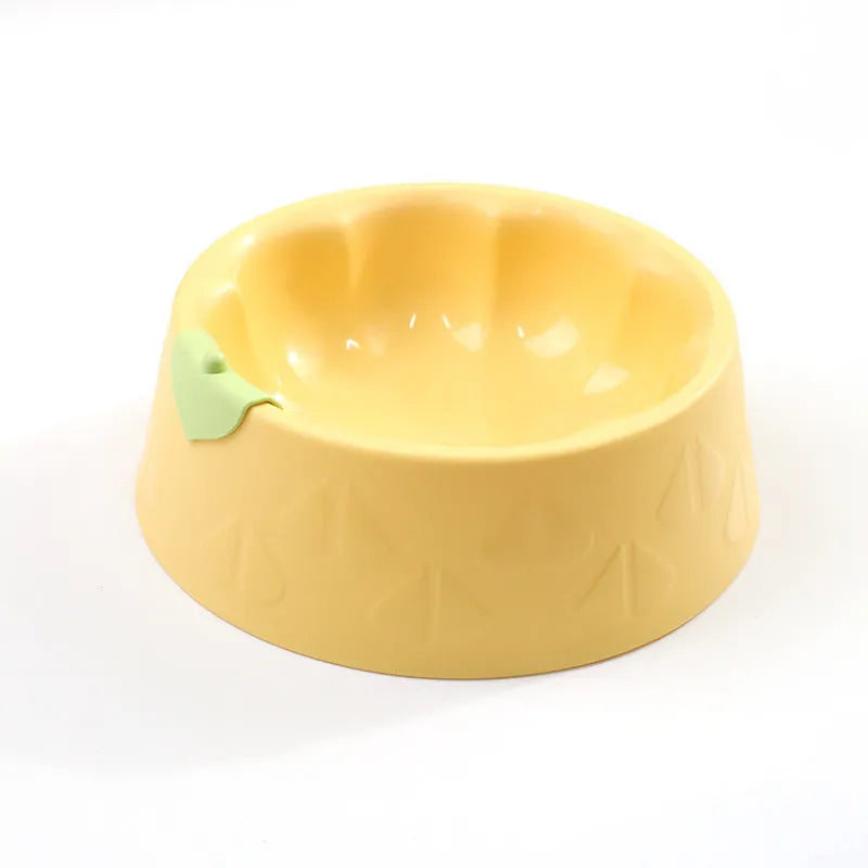 Green plastic flower-shaped double pet bowl for food and water on a white background.