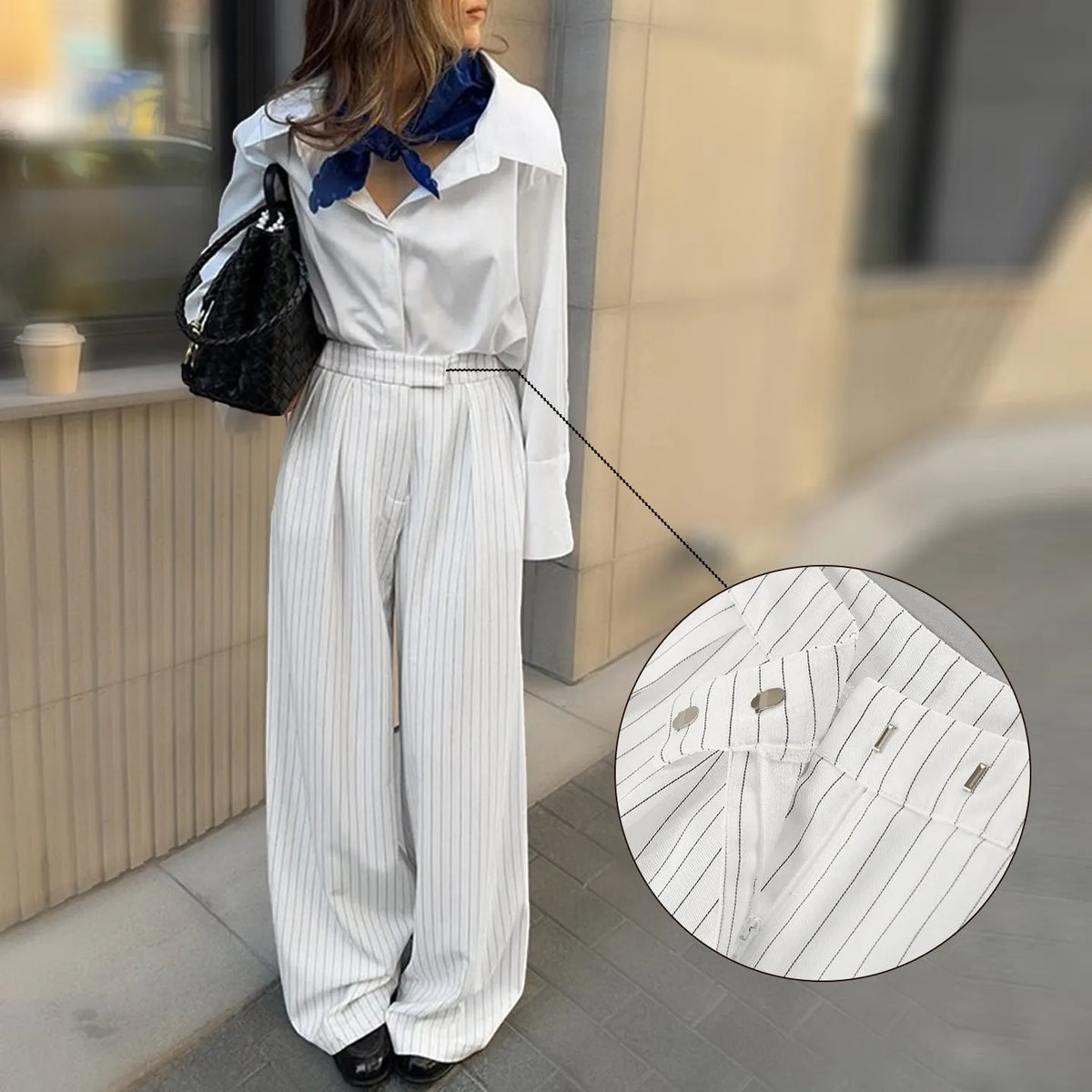 White striped wide-leg casual trousers with a zip closure on a hanger