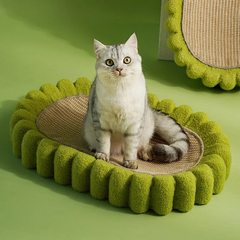 Green oval cat scratcher bed with sisal surface, showing bowl shape for scratching and sleeping