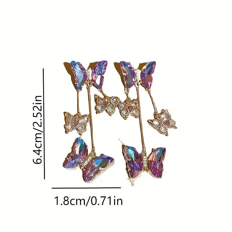 Silver needle blue purple butterfly tassel drop earrings with crystal flower details on alloy.
