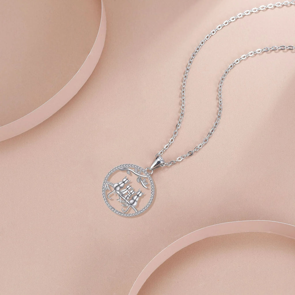 Original design four kitten copper pendant necklace with a cross chain style.