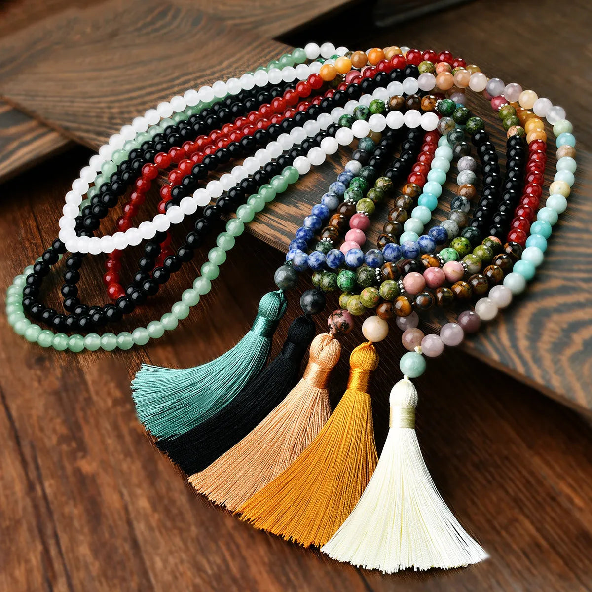 Handmade long beaded necklace with gemstone pendant and tassel, showing 81cm+ length.
