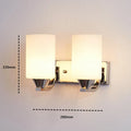 Chrome-finished glass wall lamp with minimalist design mounted on wall