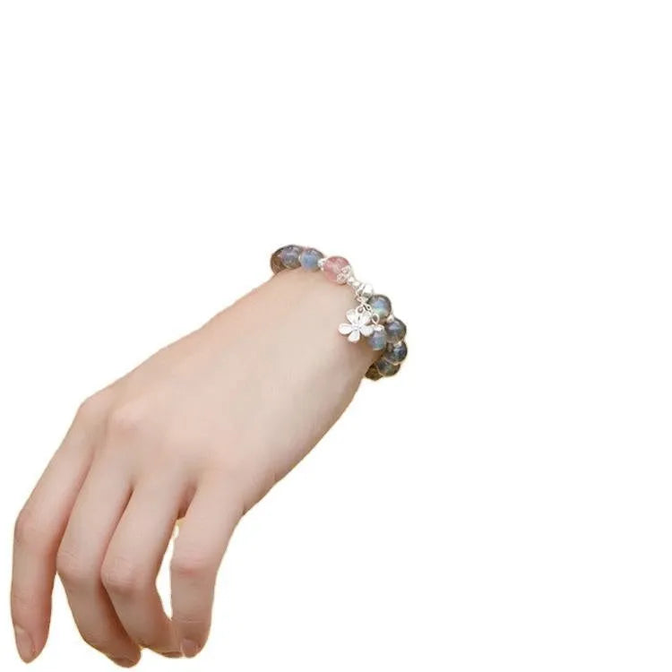 Women's crystal bracelet with 7.5mm beads and silver honeysuckle charm