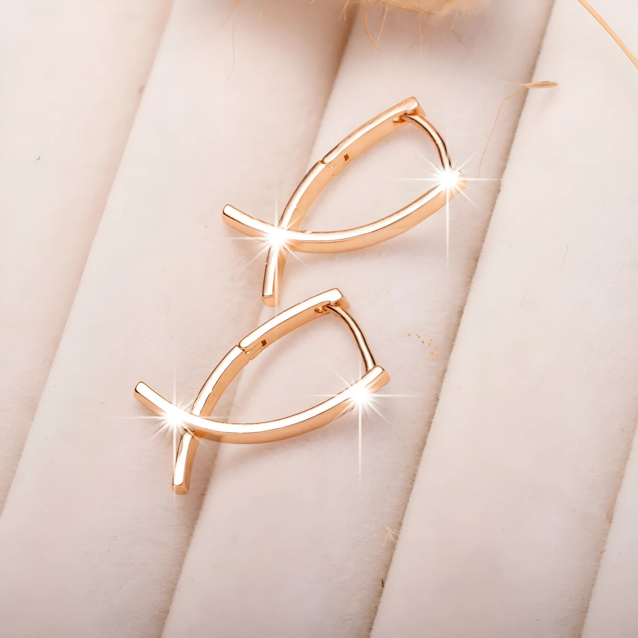 Rose gold cross shaped copper earrings with minimalist design and light luxury finish
