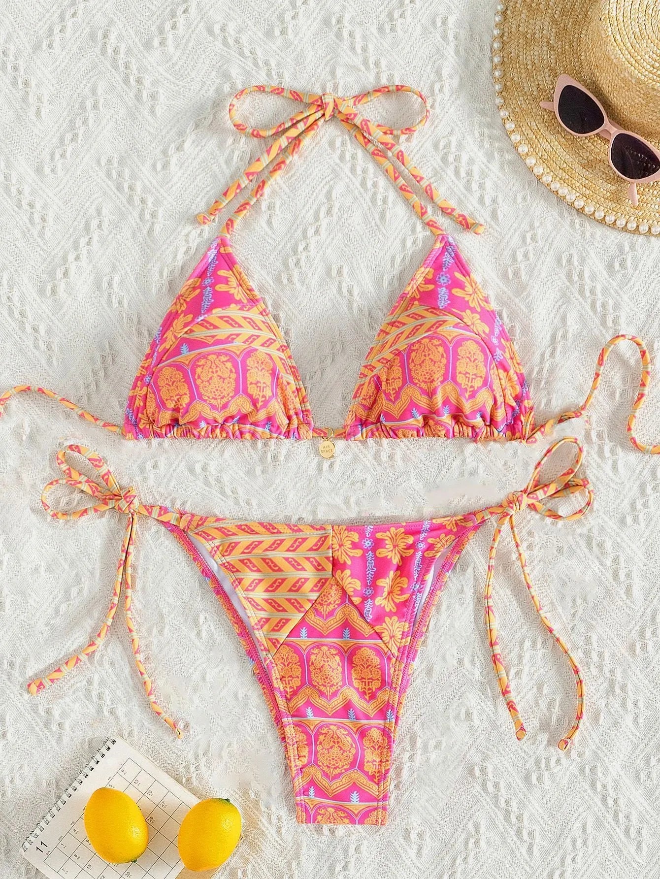 Women's split bikini swimsuit with stitching bandage design in polyester fabric for swimming