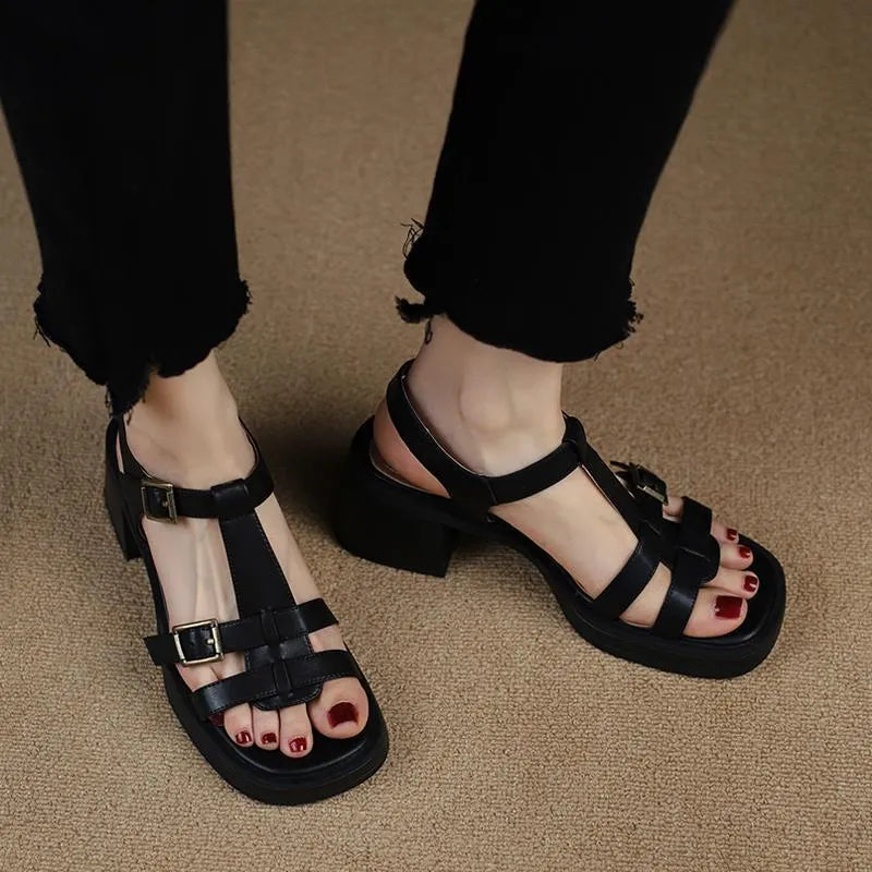 Women's black retro sandals with T-buckle strap, open toe, platform, and chunky heel