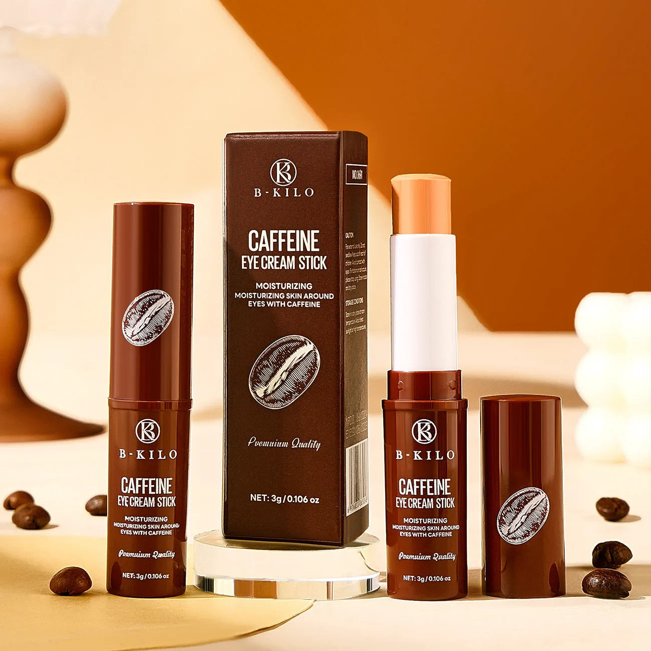 Caffeine eye cream stick in silver and white packaging, showing the 3g applicator for under-eye use.