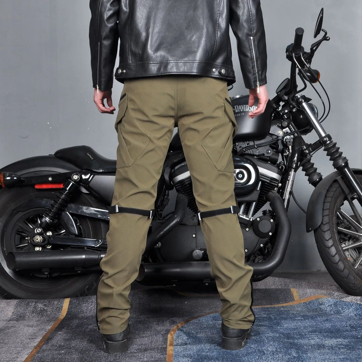 Men's waterproof motorcycle cycling trousers in black or green with included belt and protective gear.