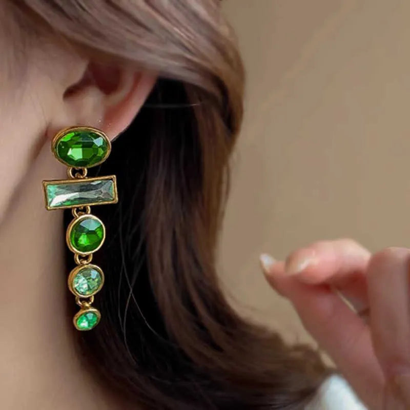 Green gradient geometric alloy earrings with dangling tassels and inlaid zircon stones.