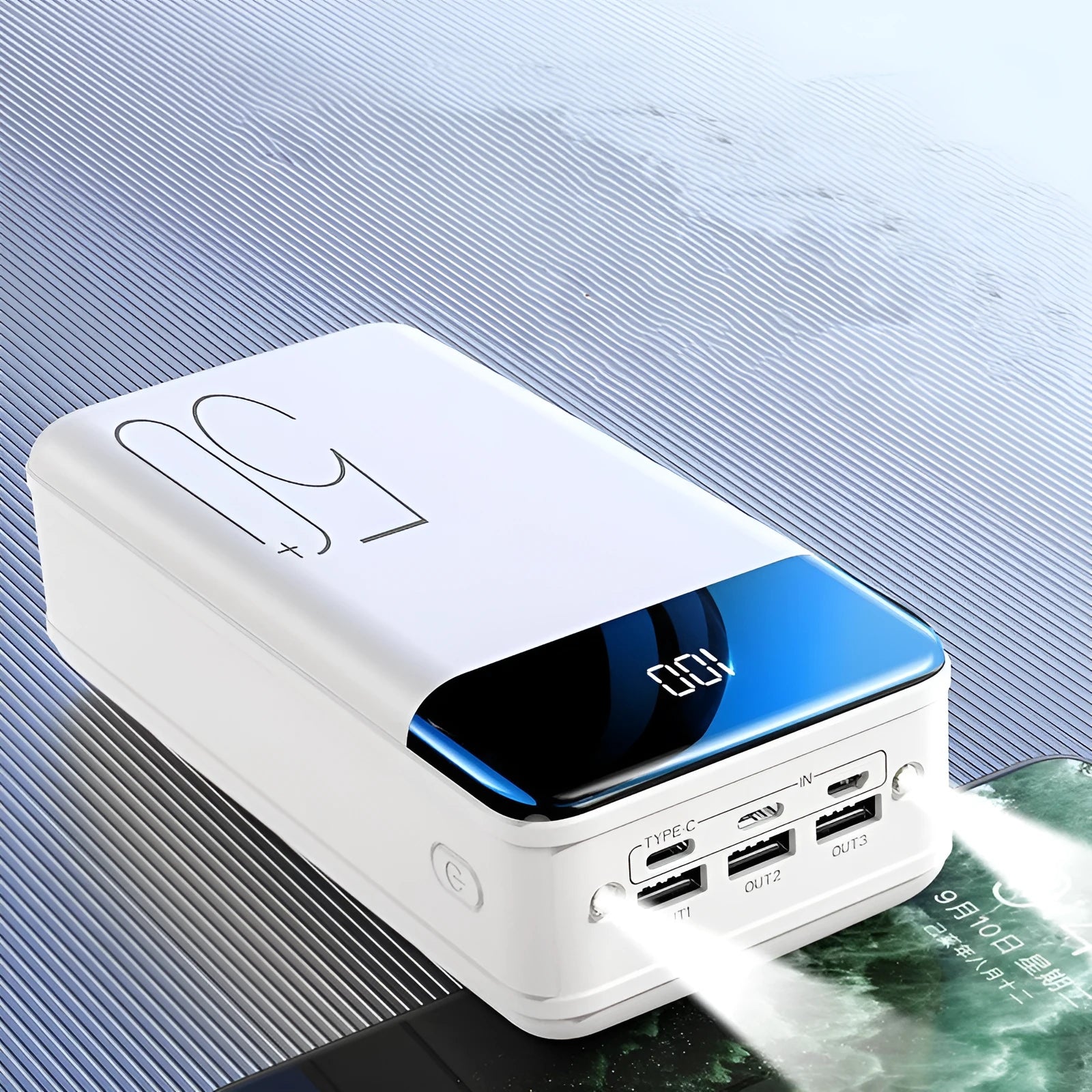 Large 50000 mAh capacity power bank with three USB ports showing black or white colour options