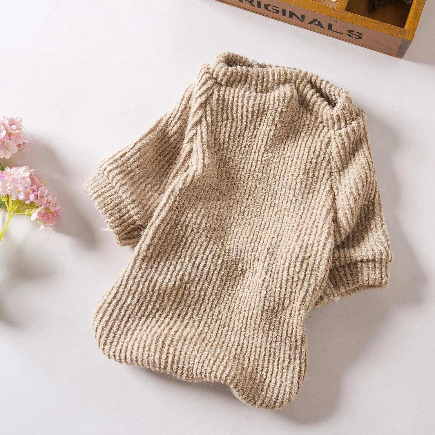Brown knitted sweater pullover on a small dog, available in sizes XS to XL