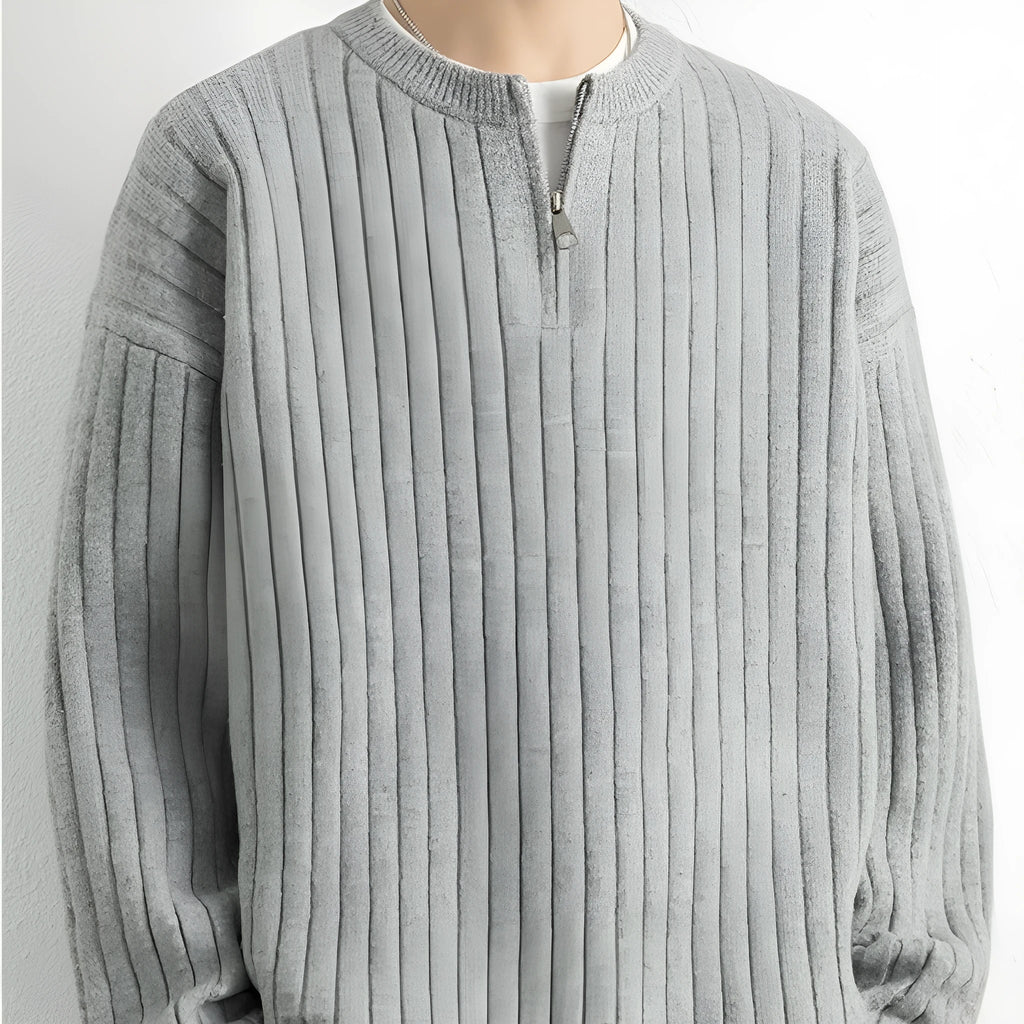 Men's grey half zip textured knit sweater with a loose fit and long sleeves.
