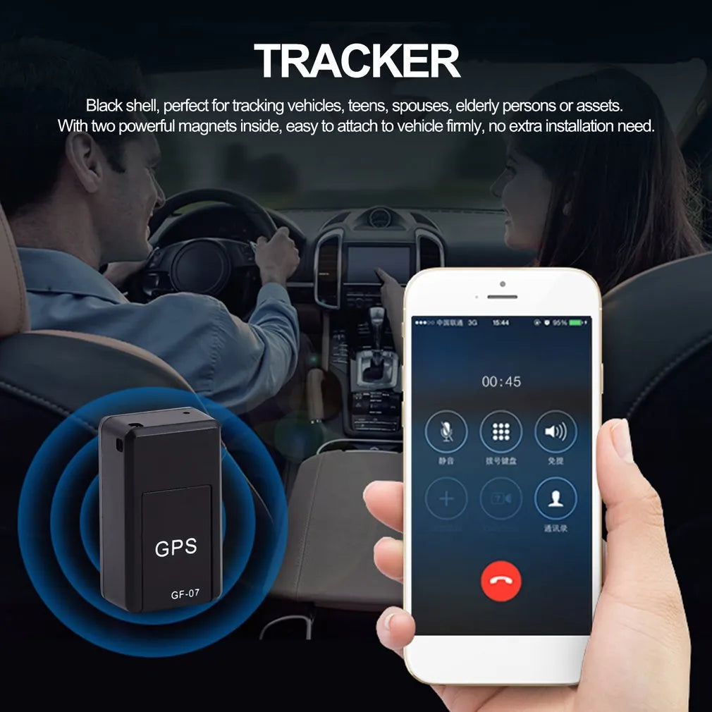 Small black plastic magnetic GPS tracker device with USB charging cable.