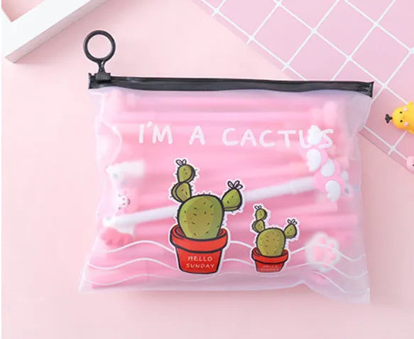 Open plastic case showing twenty 0.5mm black gel pens with cartoon cactus designs for boys and girls.