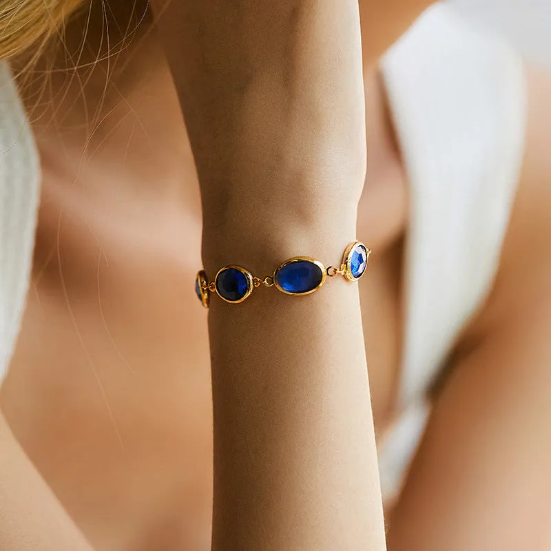 Geometric ellipse bracelet in 18K copper with blue glass inlay embroidery